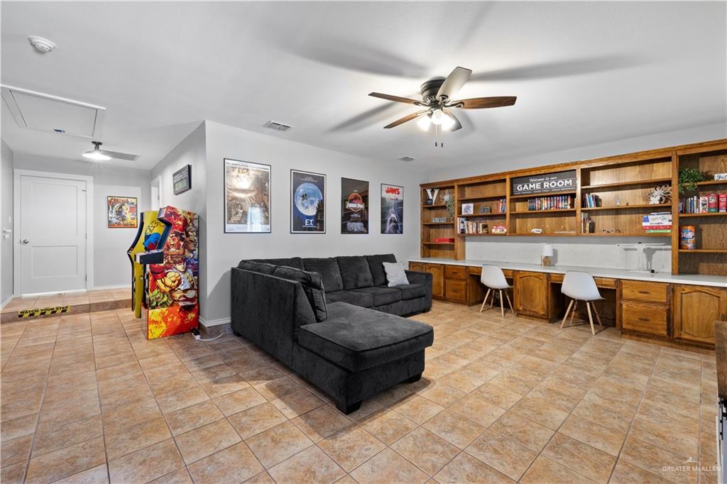 2212 North Bryan Rd Mission Mission, TX 78572 - Photo 32 of 44 a living room with furniture and a flat screen tv