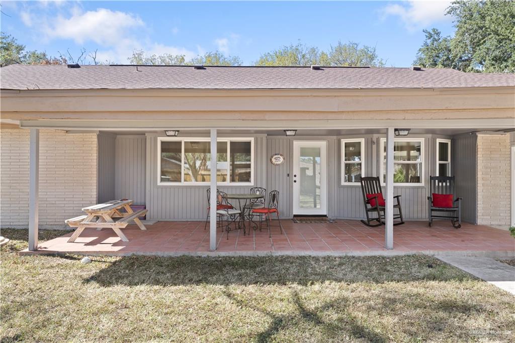 2212 North Bryan Rd Mission Mission, TX 78572 - Photo 33 of 44 a view of a bedroom with a lounge chair and floor to ceiling window