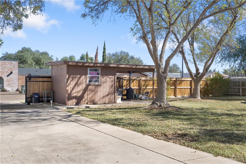 2212 North Bryan Rd Mission Mission, TX 78572 - Photo 36 of 44 a view of a barn in the middle of a yard
