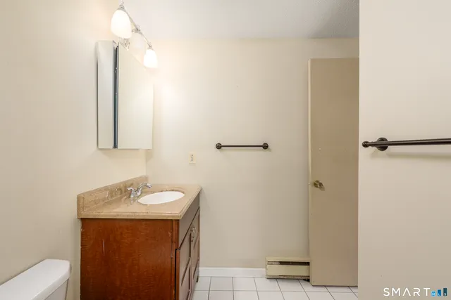 a bathroom with a sink and mirror