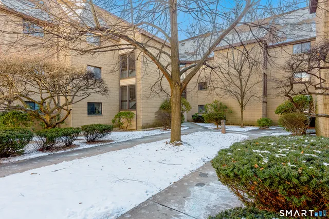 a pathway of a house with a yard