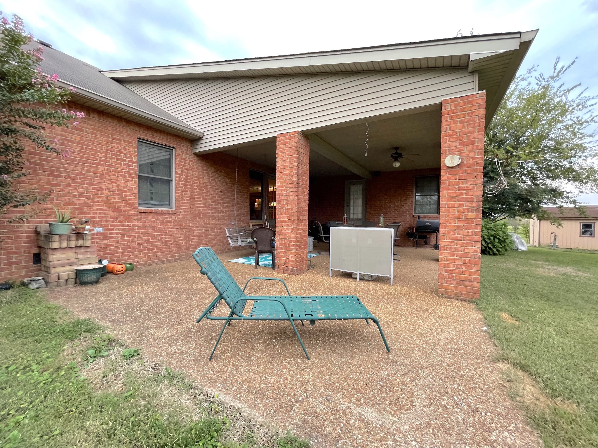455 South Commerce Road Watertown, TN 37184 - Photo 14 of 48 a backyard of a house with table and chairs
