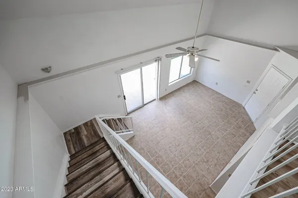 a view of an empty room with windows