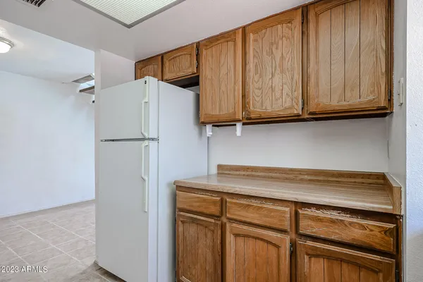 a close view of a refrigerator and cabinets