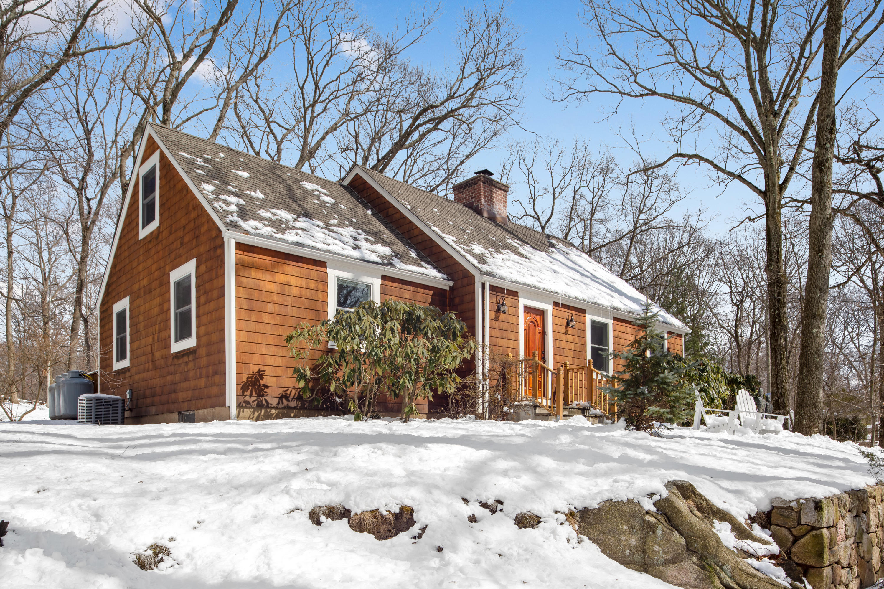 10 Little Brook Road Rowayton, CT 06853 - Photo 1 of 16 a view of a house with a yard covered in snow