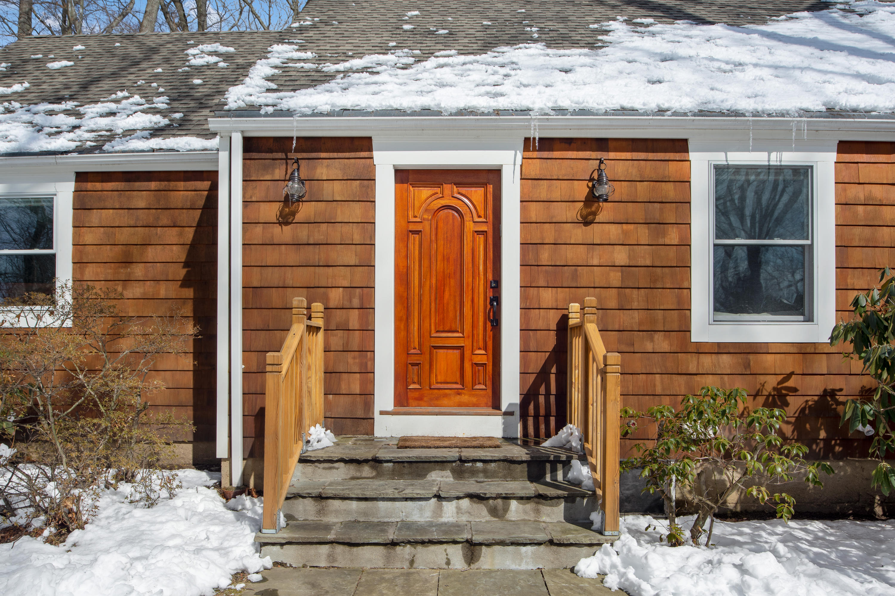 10 Little Brook Road Rowayton, CT 06853 - Photo 2 of 16 a front view of a house with a window