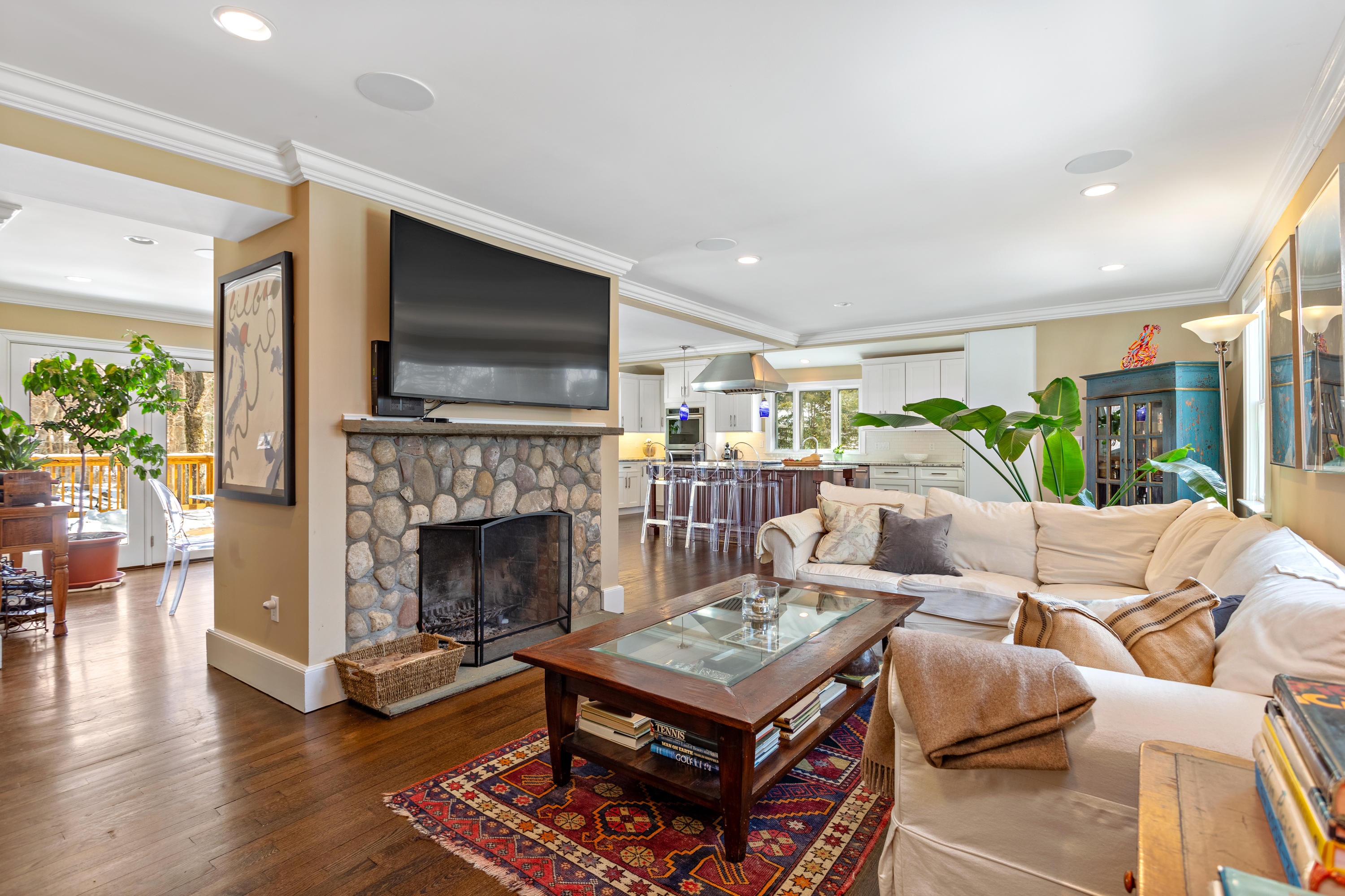 10 Little Brook Road Rowayton, CT 06853 - Photo 4 of 16 a living room with furniture a flat screen tv and a fireplace