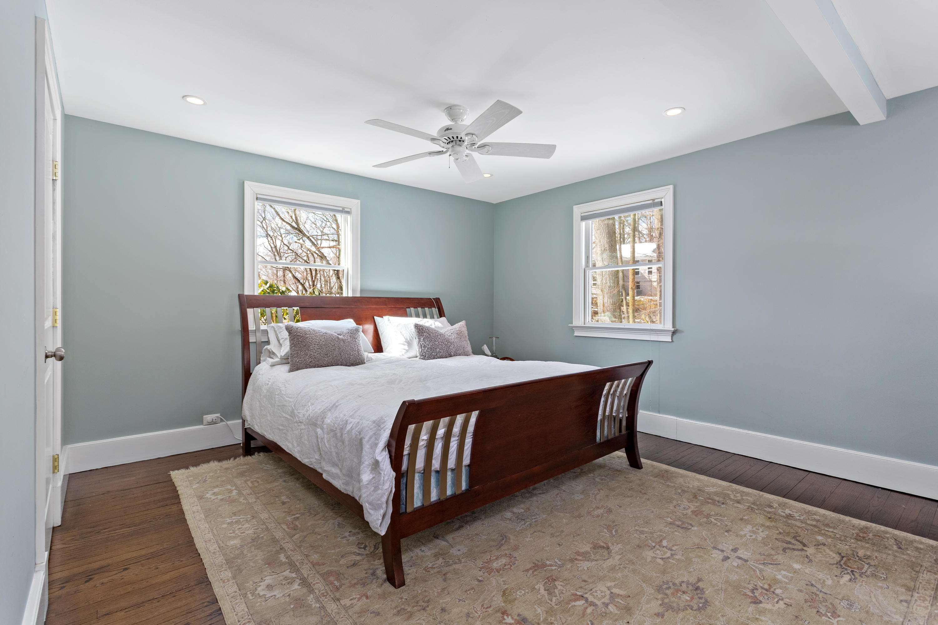 10 Little Brook Road Rowayton, CT 06853 - Photo 8 of 16 a bed sitting in a bedroom next to a window