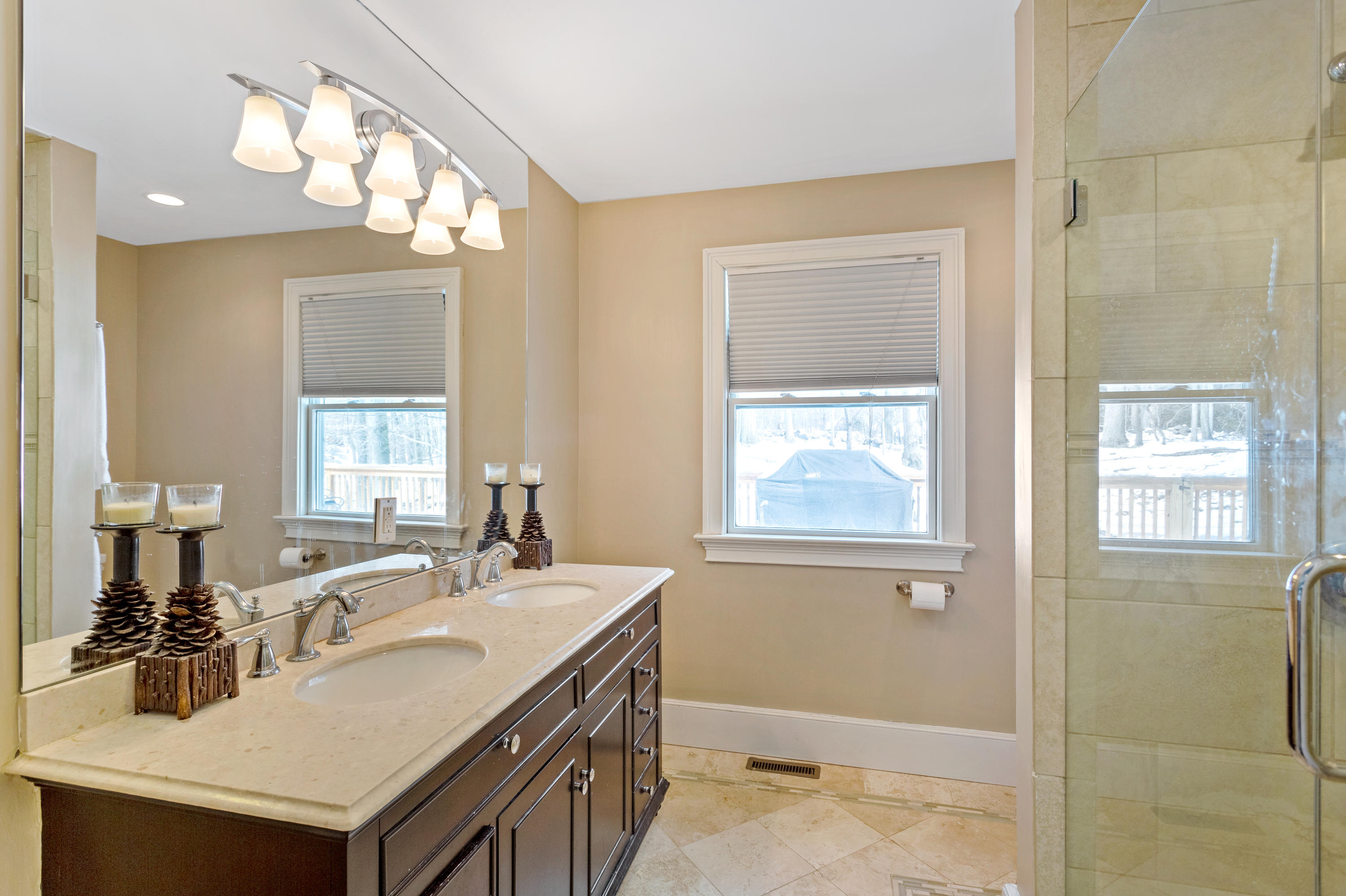 10 Little Brook Road Rowayton, CT 06853 - Photo 10 of 16 a bathroom with a sink double vanity and a mirror
