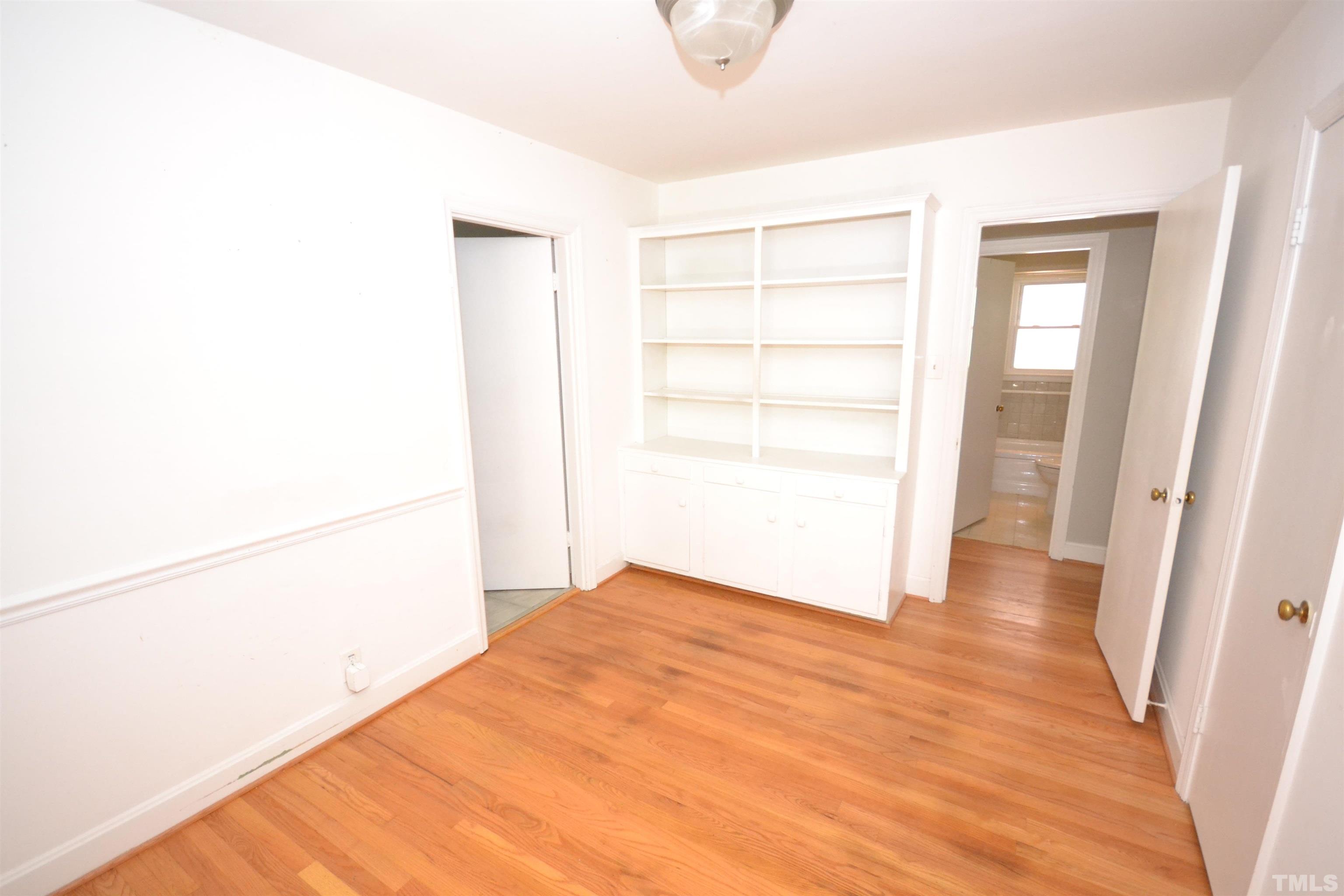 1713 Forest Road Durham, NC 27705 - Photo 12 of 35 a view of empty room with wooden floor
