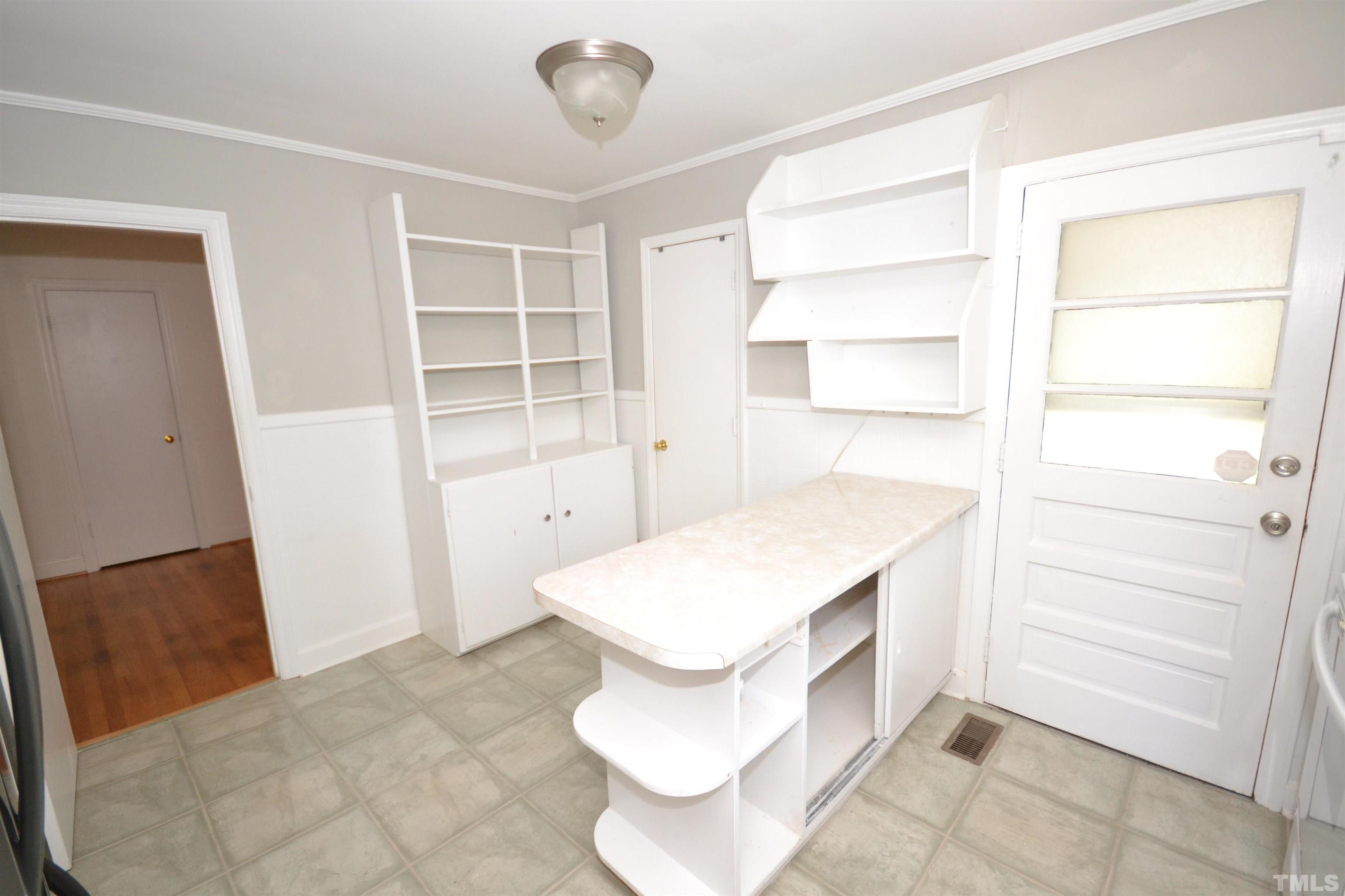 1713 Forest Road Durham, NC 27705 - Photo 16 of 35 a bathroom with a sink and a mirror