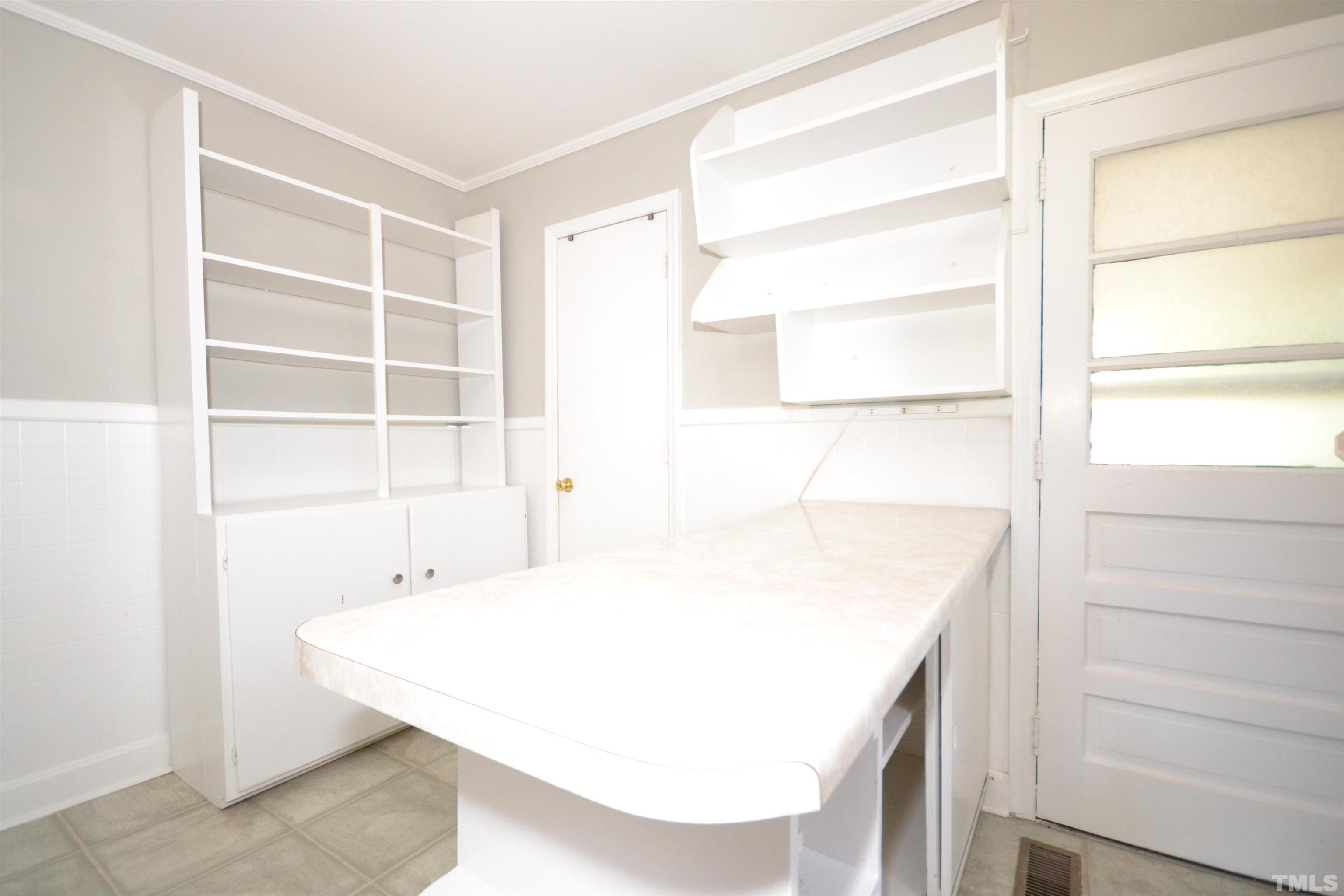 1713 Forest Road Durham, NC 27705 - Photo 23 of 35 a view of a kitchen with a sink and a cabinet