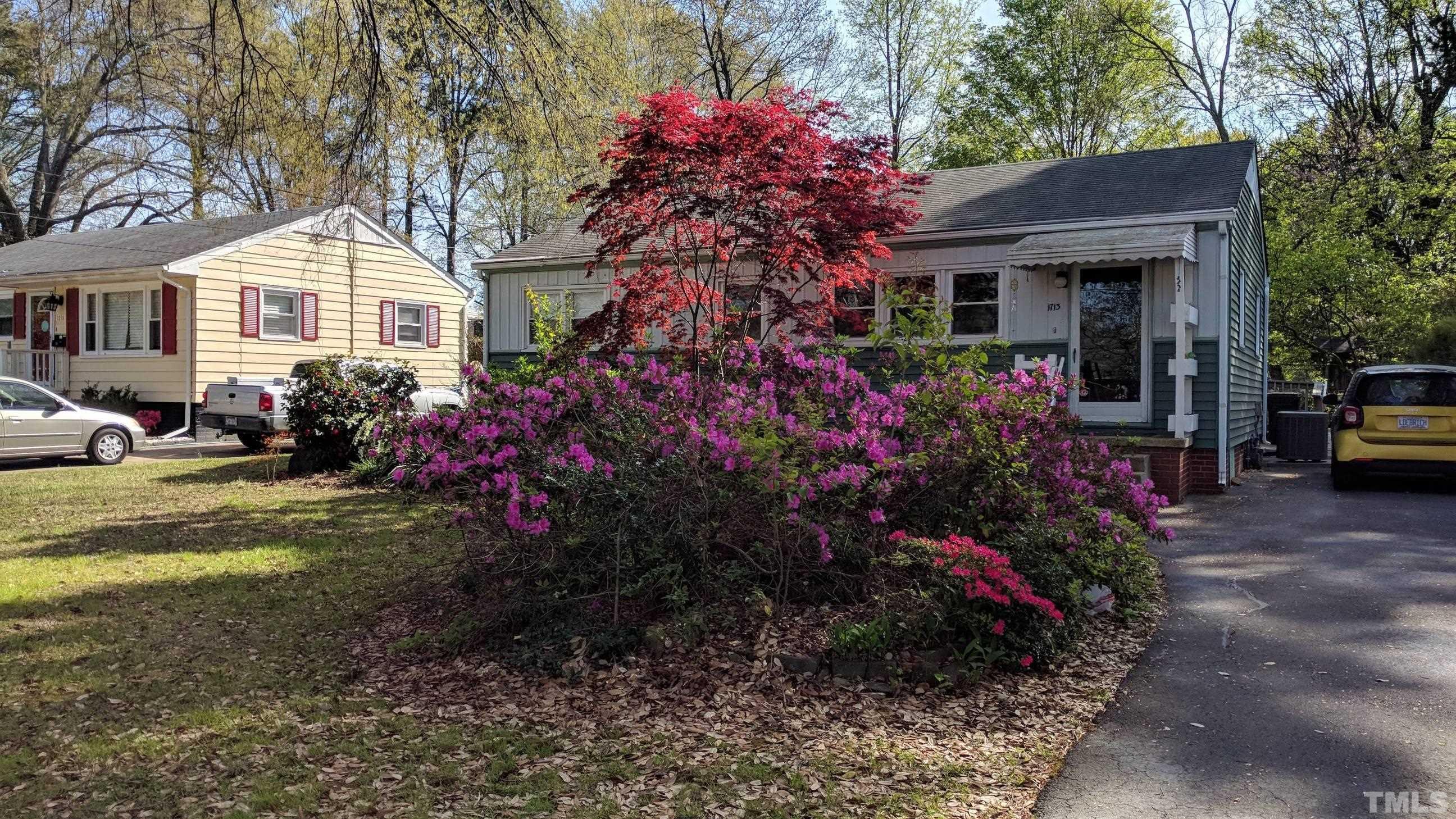 1713 Forest Road Durham, NC 27705 - Photo 28 of 35 a front view of a house with a garden and pathway