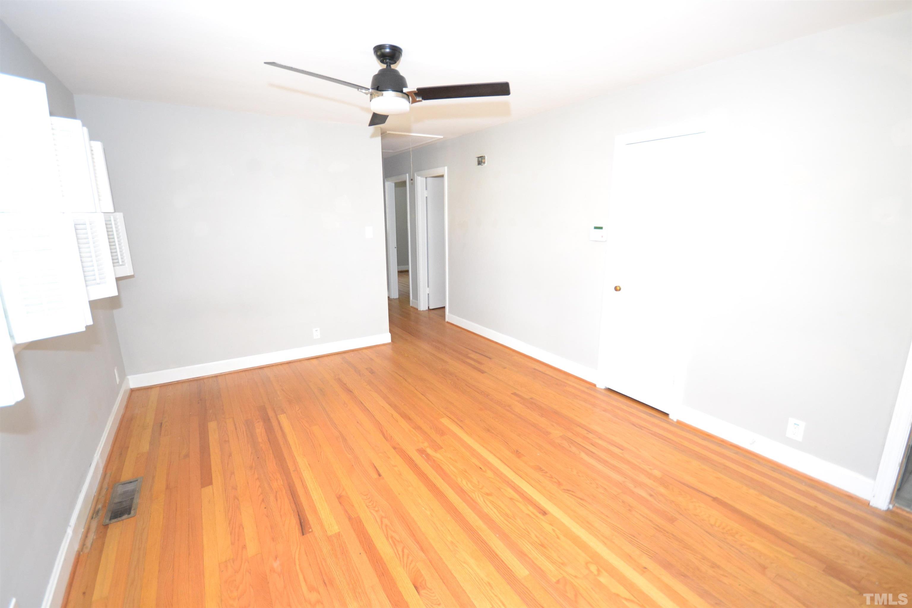 1713 Forest Road Durham, NC 27705 - Photo 5 of 35 a view of a big room with wooden floor