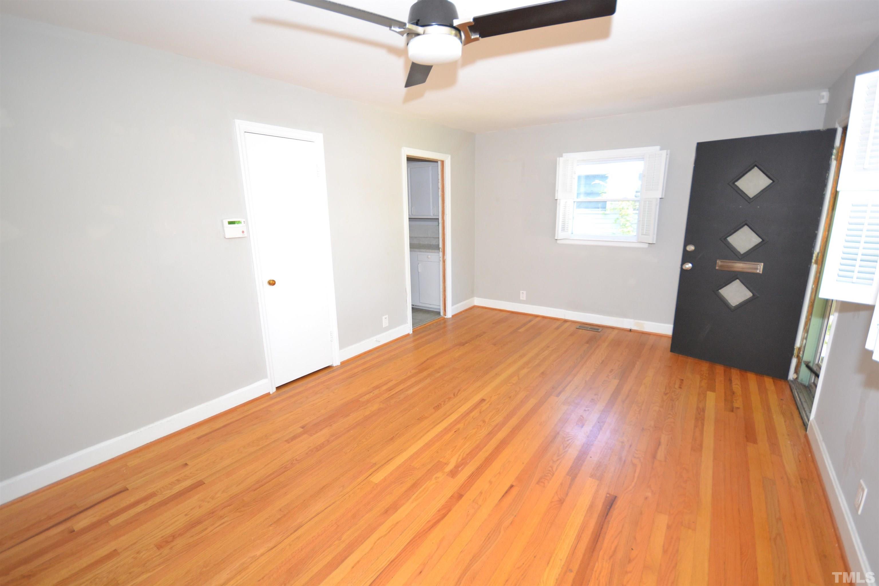 1713 Forest Road Durham, NC 27705 - Photo 7 of 35 a bedroom with a bed and a rug