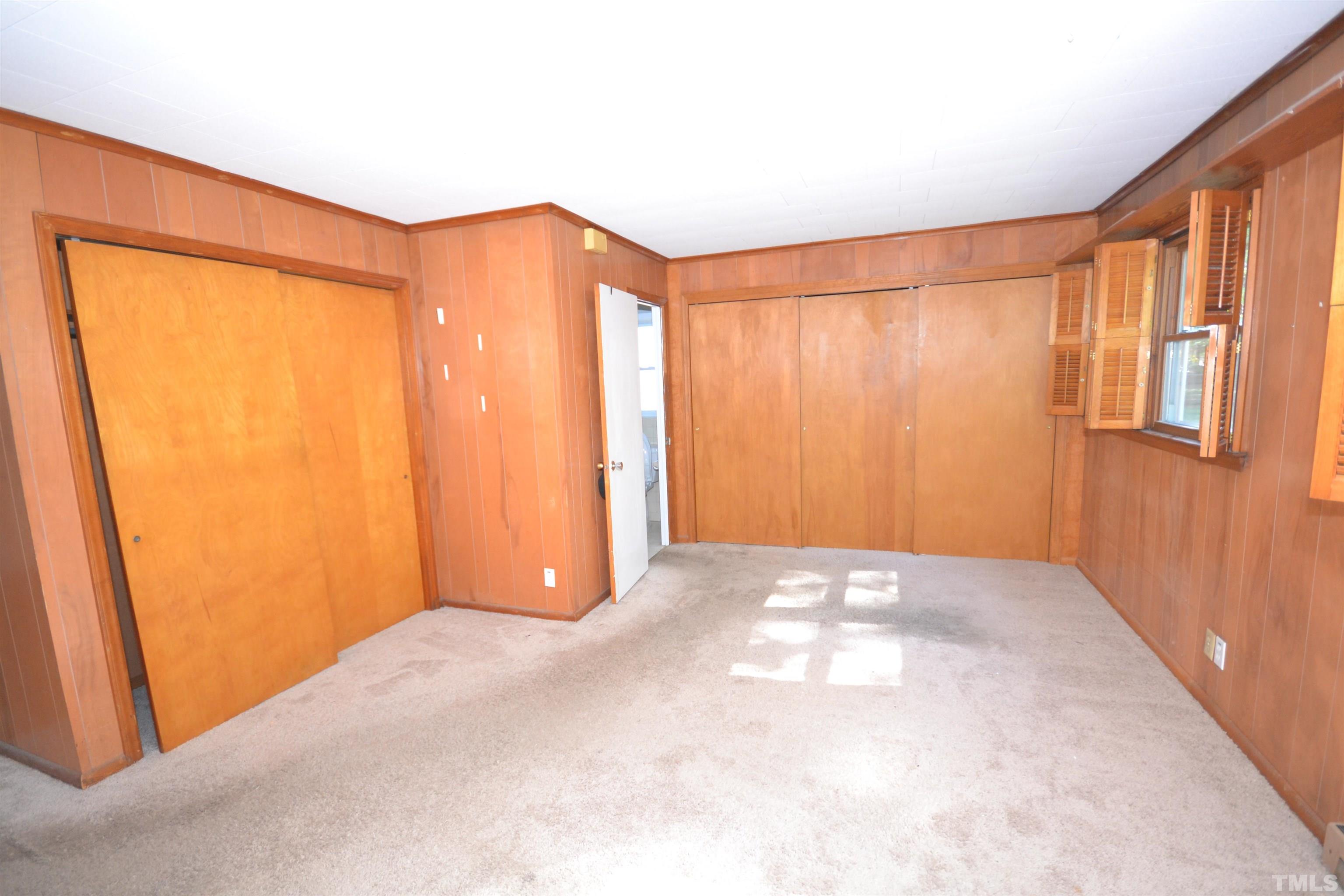 1713 Forest Road Durham, NC 27705 - Photo 10 of 35 a view of an empty room with a window