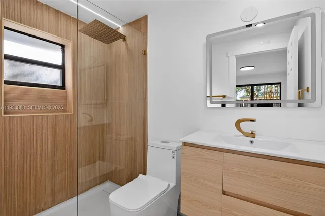 a backyard with wooden fence and a patio