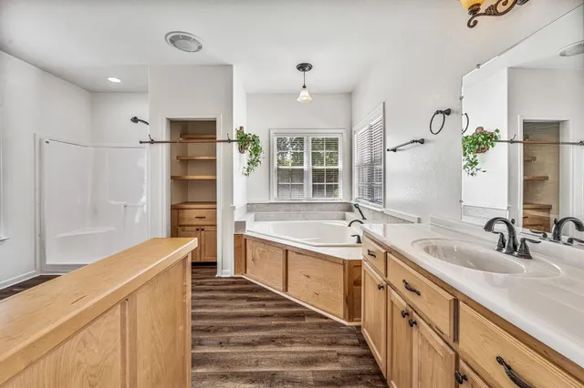 a kitchen with stainless steel appliances a sink and a refrigerator
