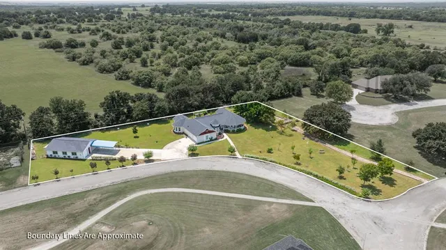 an aerial view of a house with a swimming pool
