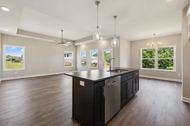 a view of kitchen with cabinets and wooden floor