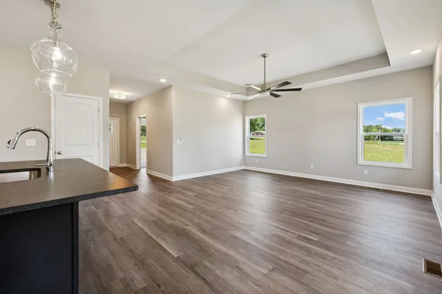 a bathroom with a granite countertop sink mirror and shower