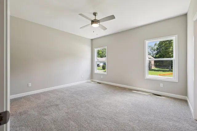 a spacious bathroom with a mirror a double vanity sink and a mirror