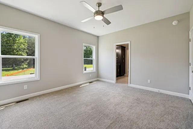 a bathroom with a granite countertop sink a mirror and a vanity