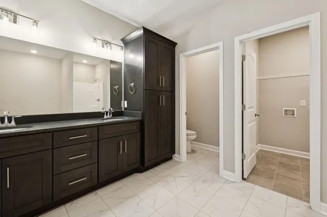 an empty room with windows and entrance