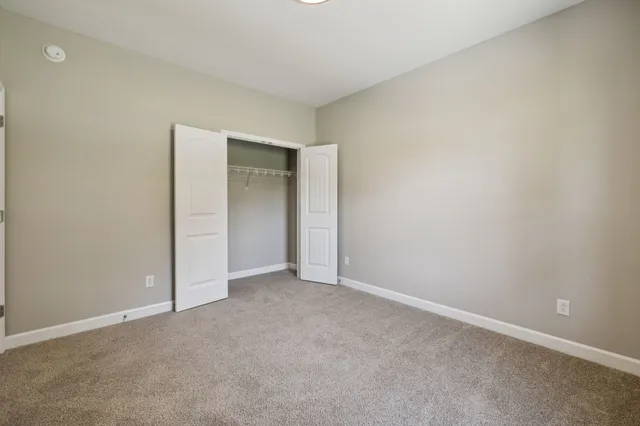 a bathroom with a granite countertop toilet a sink and a bathtub