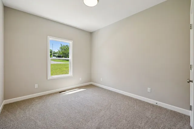 a view of entryway with wooden floor and stairs