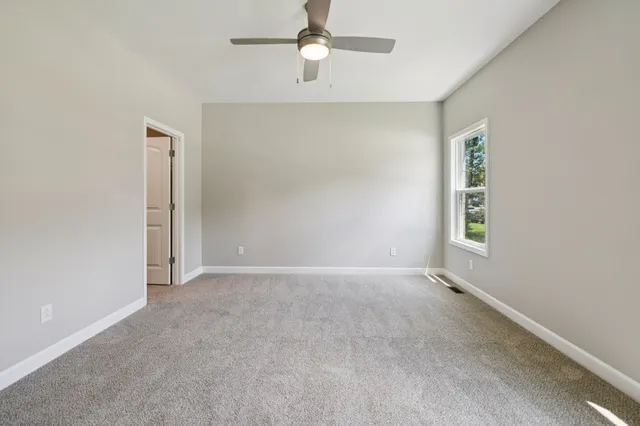 a view of a livingroom with a ceiling fan