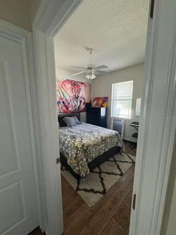 a bathroom with a sink a toilet a mirror and shower curtain