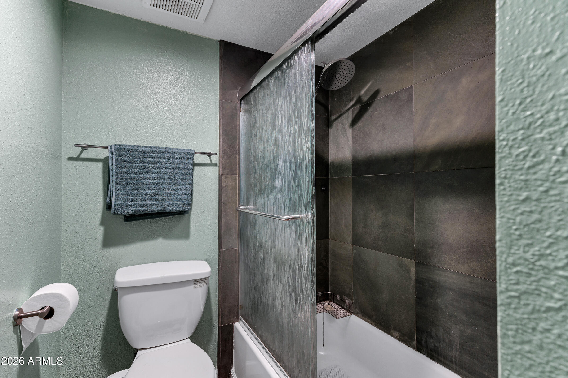 4410 North Longview Avenue, Unit 119 Phoenix, AZ 85014 - Photo 12 of 22 a bathroom with a toilet and a shower