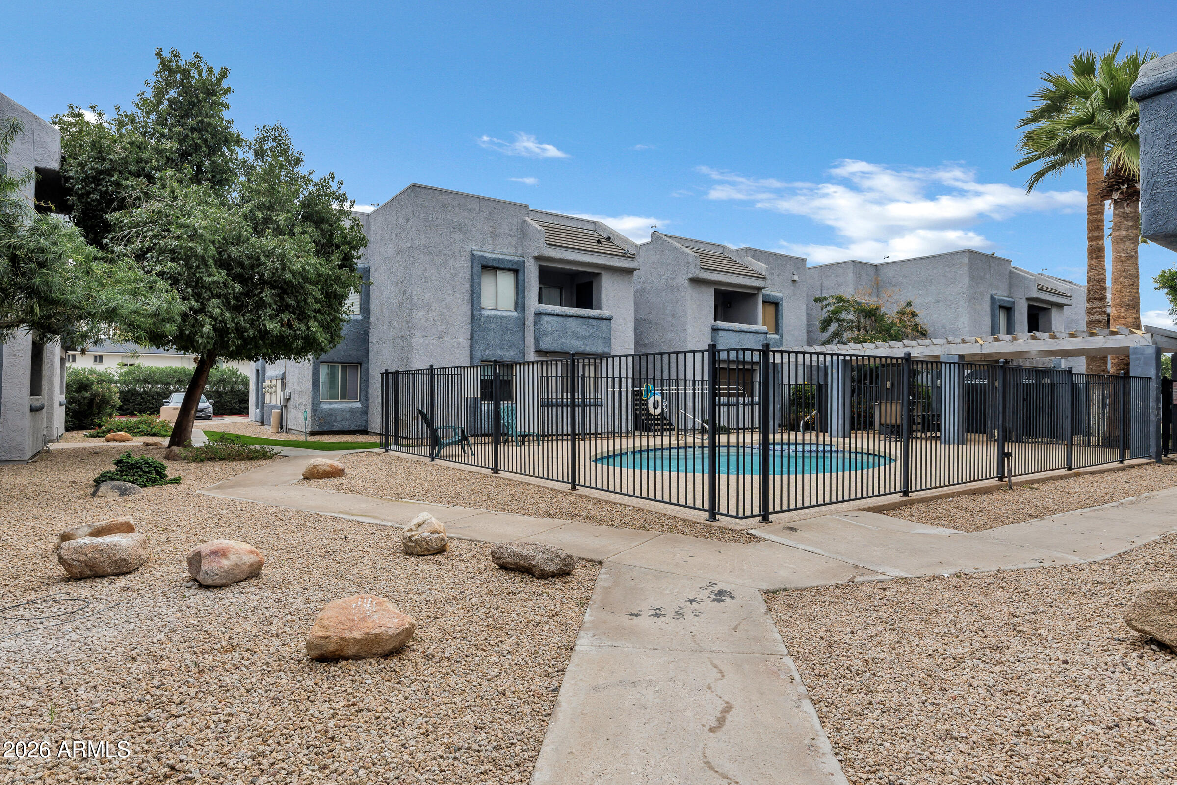 4410 North Longview Avenue, Unit 119 Phoenix, AZ 85014 - Photo 20 of 22 a view of a backyard with sitting area