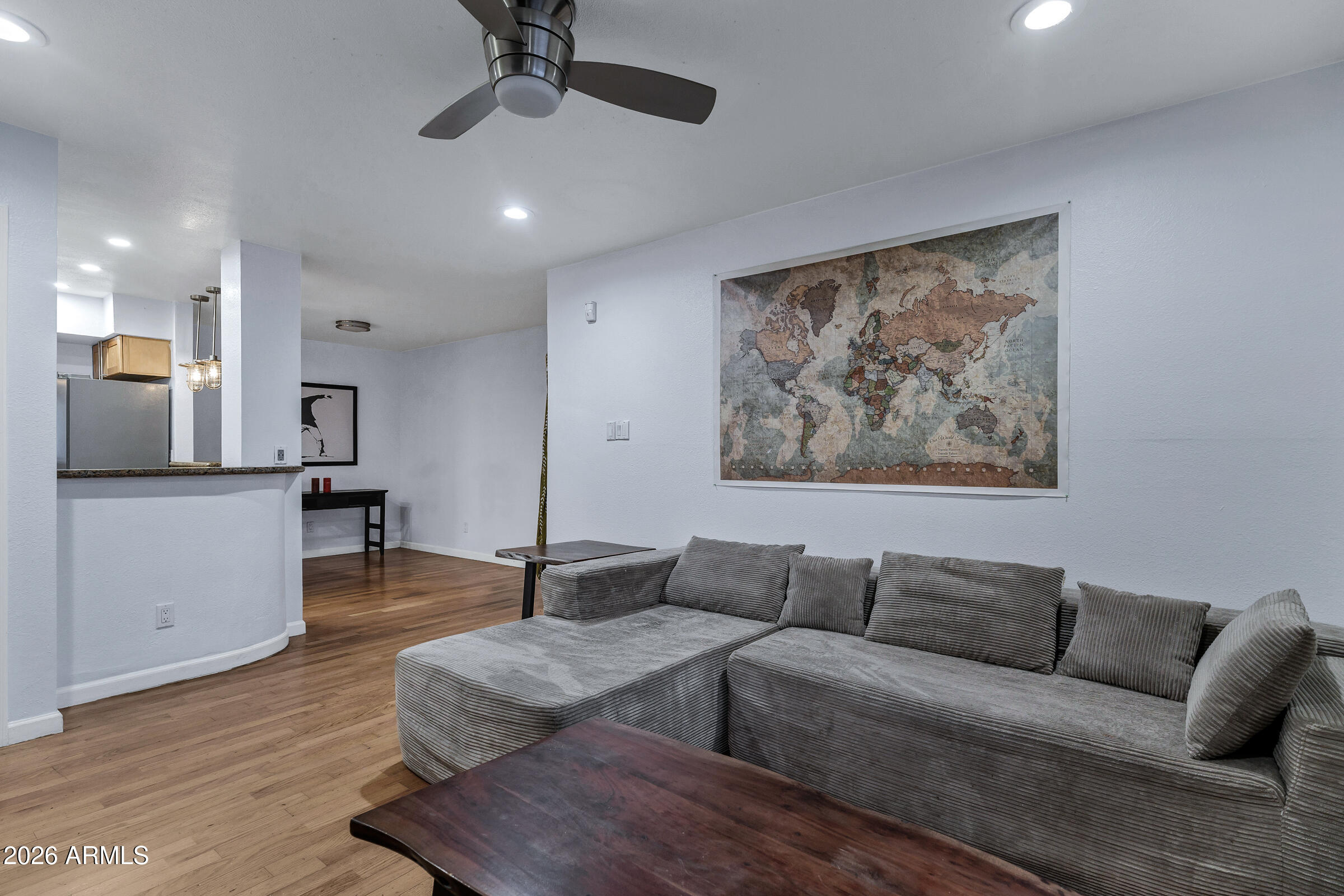 4410 North Longview Avenue, Unit 119 Phoenix, AZ 85014 - Photo 6 of 22 a living room with furniture and a wooden floor