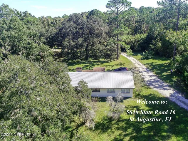 an aerial view of a house with a garden