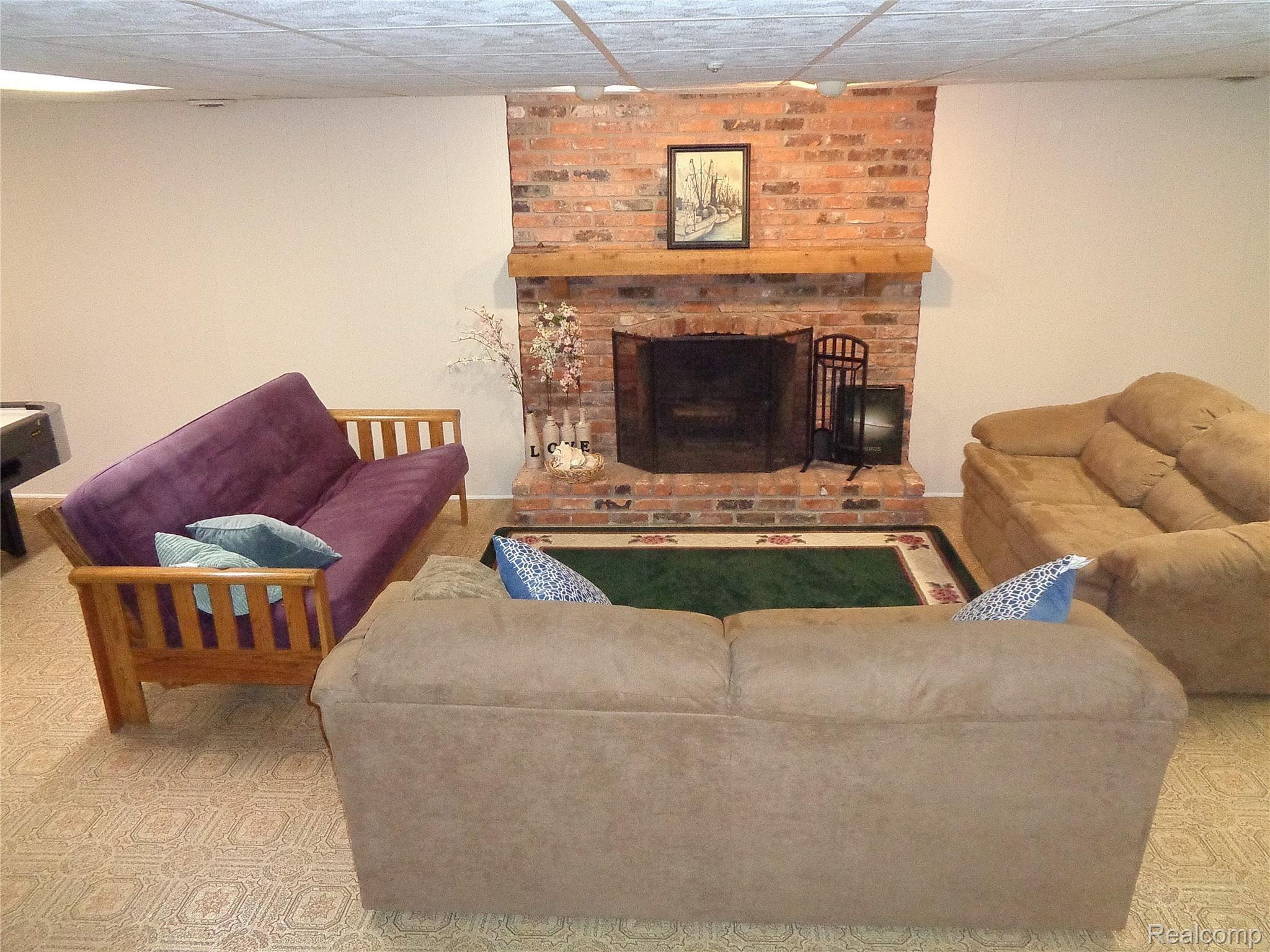 811 Hidden Pine Road Bloomfield Hills, MI 48304 - Photo 35 of 47 Finished basement with brick fireplace