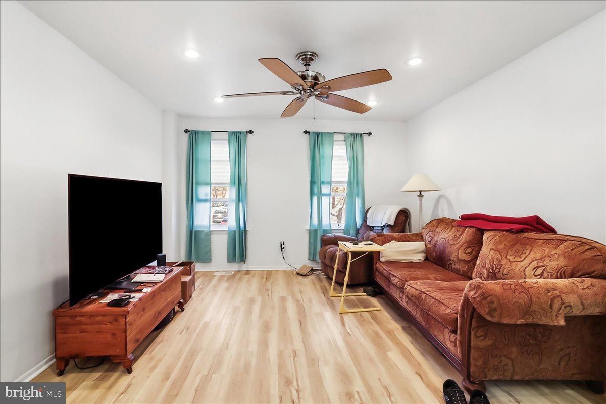 12062 Abby Road Philadelphia, PA 19154 - Photo 12 of 28 a living room with furniture and a flat screen tv