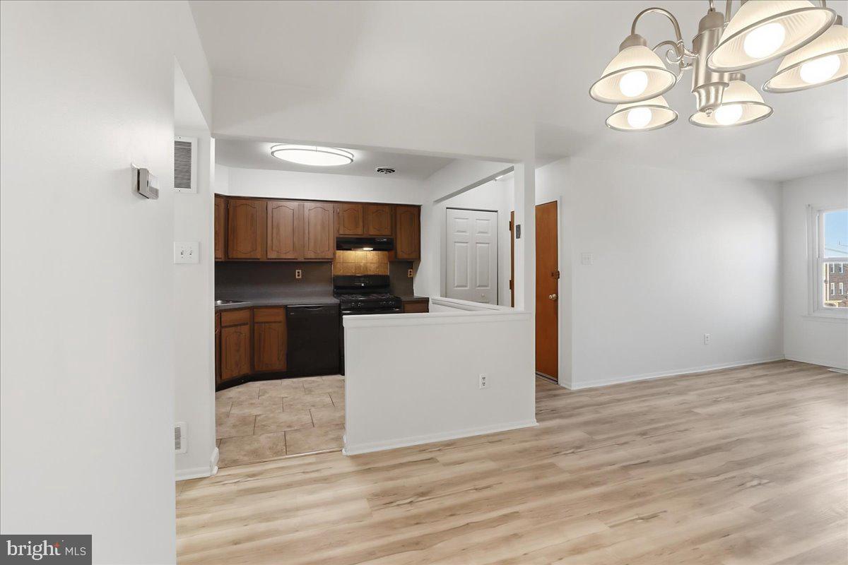 12062 Abby Road Philadelphia, PA 19154 - Photo 16 of 28 a kitchen with a refrigerator and cabinets