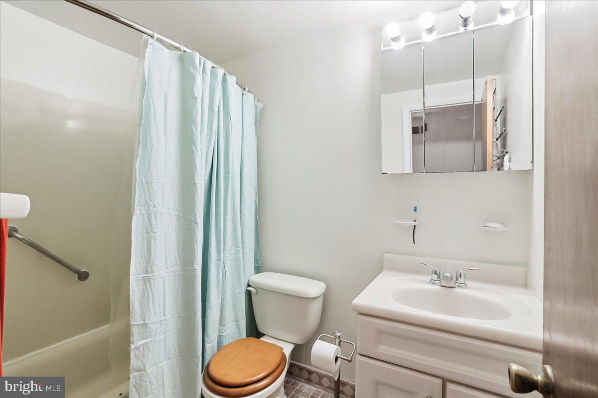 12062 Abby Road Philadelphia, PA 19154 - Photo 6 of 28 a bathroom with a sink a toilet and shower