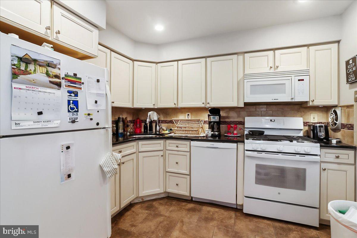 12062 Abby Road Philadelphia, PA 19154 - Photo 9 of 28 a kitchen with stainless steel appliances granite countertop a sink and cabinets