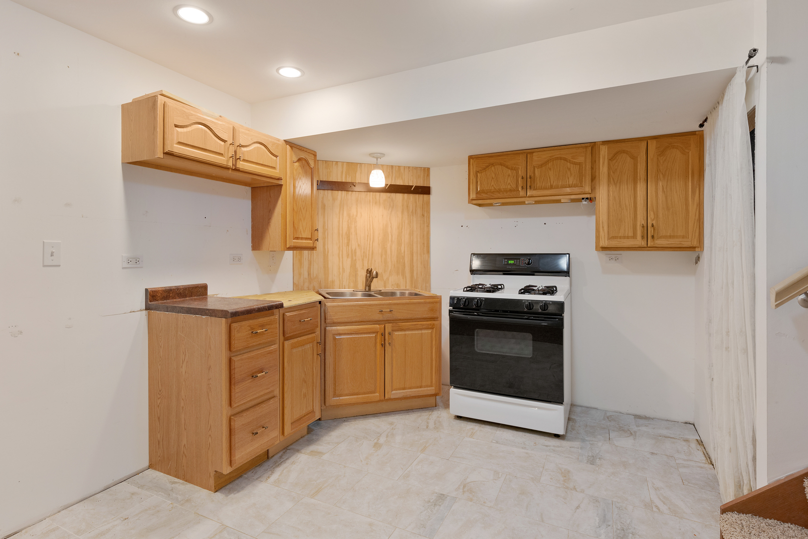 1950 Tanglewood Drive Algonquin, IL 60102 - Photo 28 of 34 a kitchen with sink a microwave and cabinets