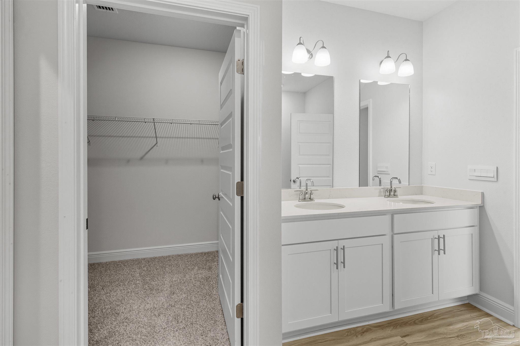 3460 Crossvine Road Cantonment, FL 32533 - Photo 12 of 41 a bathroom with a granite countertop sink and a mirror