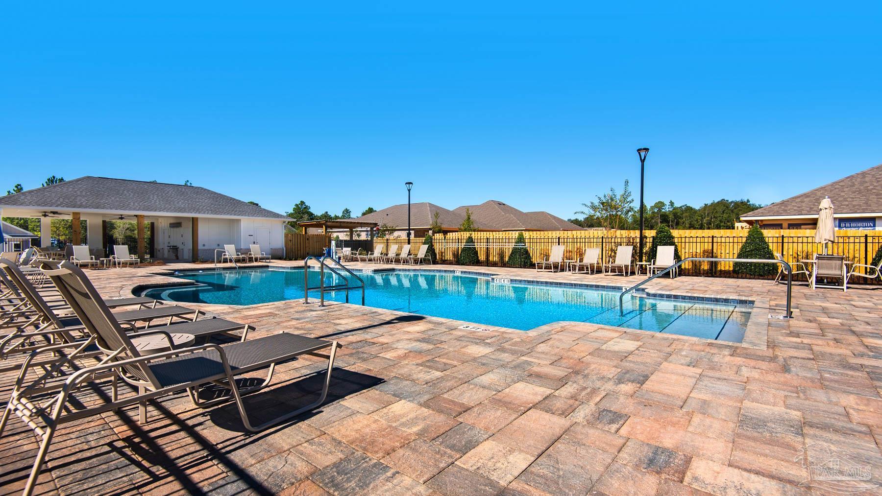3460 Crossvine Road Cantonment, FL 32533 - Photo 4 of 41 a view of swimming pool with outdoor seating and yard
