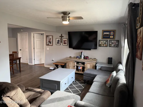 a living room with furniture and a flat screen tv