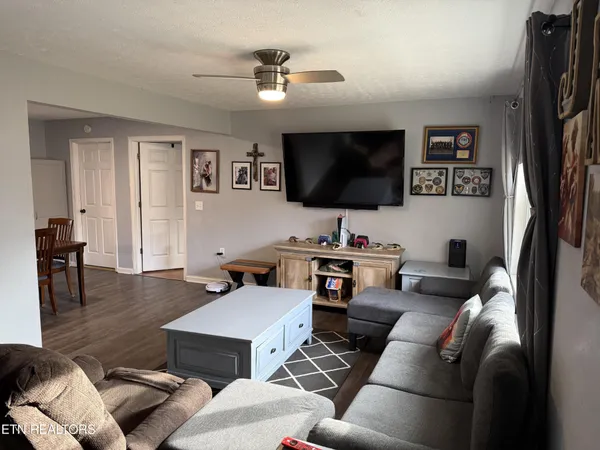 a living room with furniture and a flat screen tv