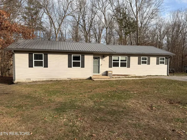 a front view of a house with yard