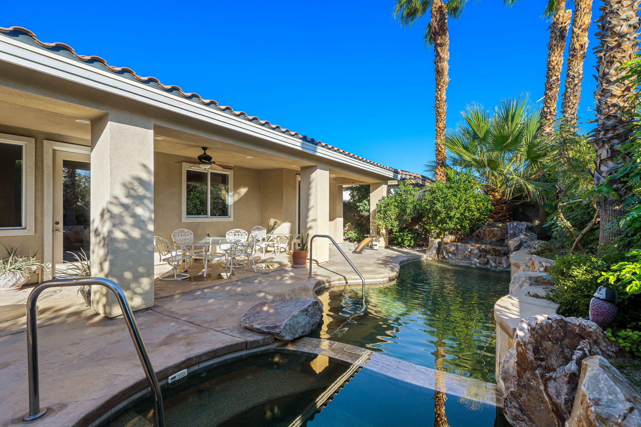 83399 Wagon Road Indio, CA 92203 - Photo 15 of 48 a view of a house with swimming pool and sitting area