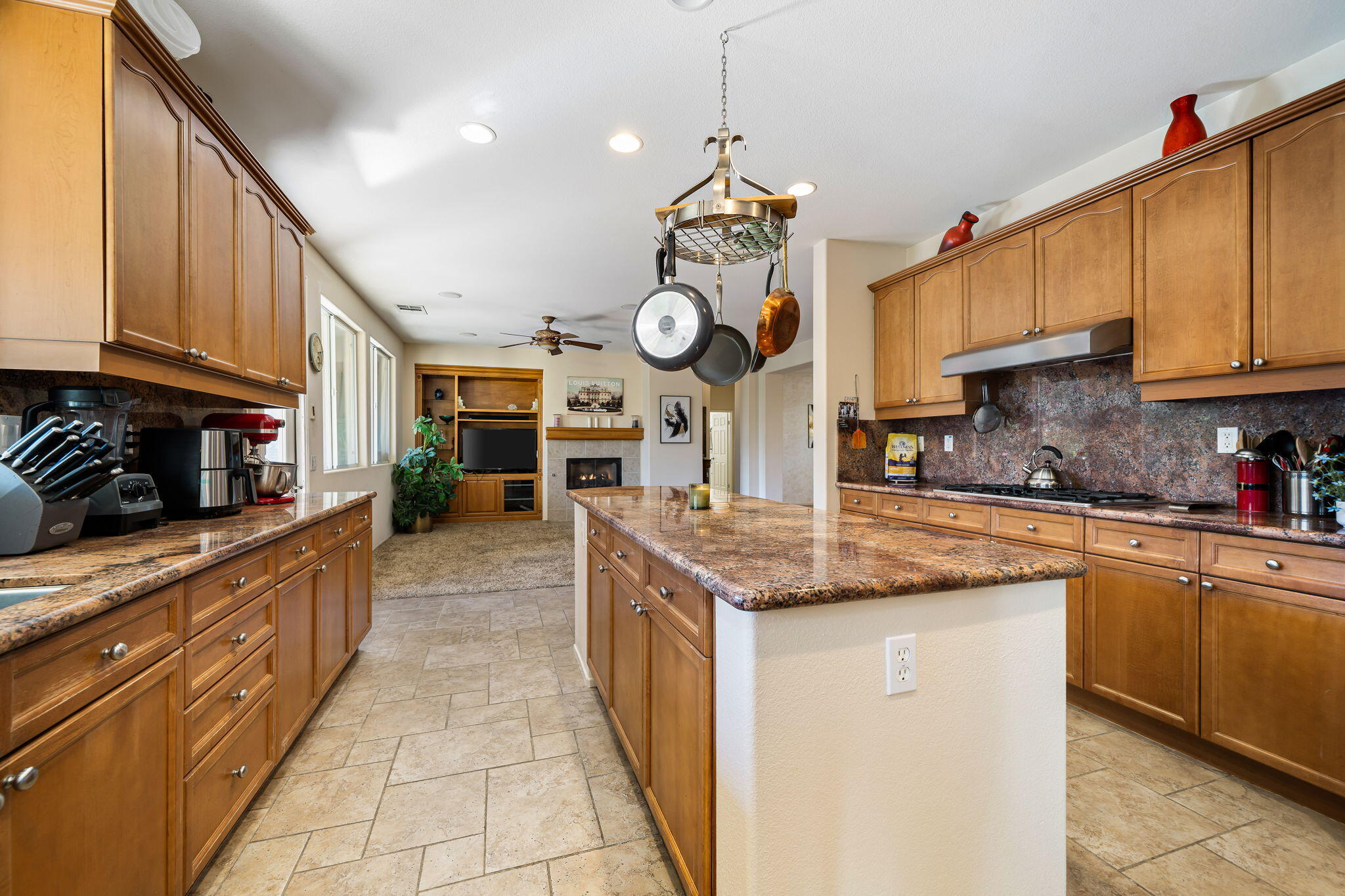 83399 Wagon Road Indio, CA 92203 - Photo 18 of 48 a kitchen with granite countertop a sink a stove and cabinets