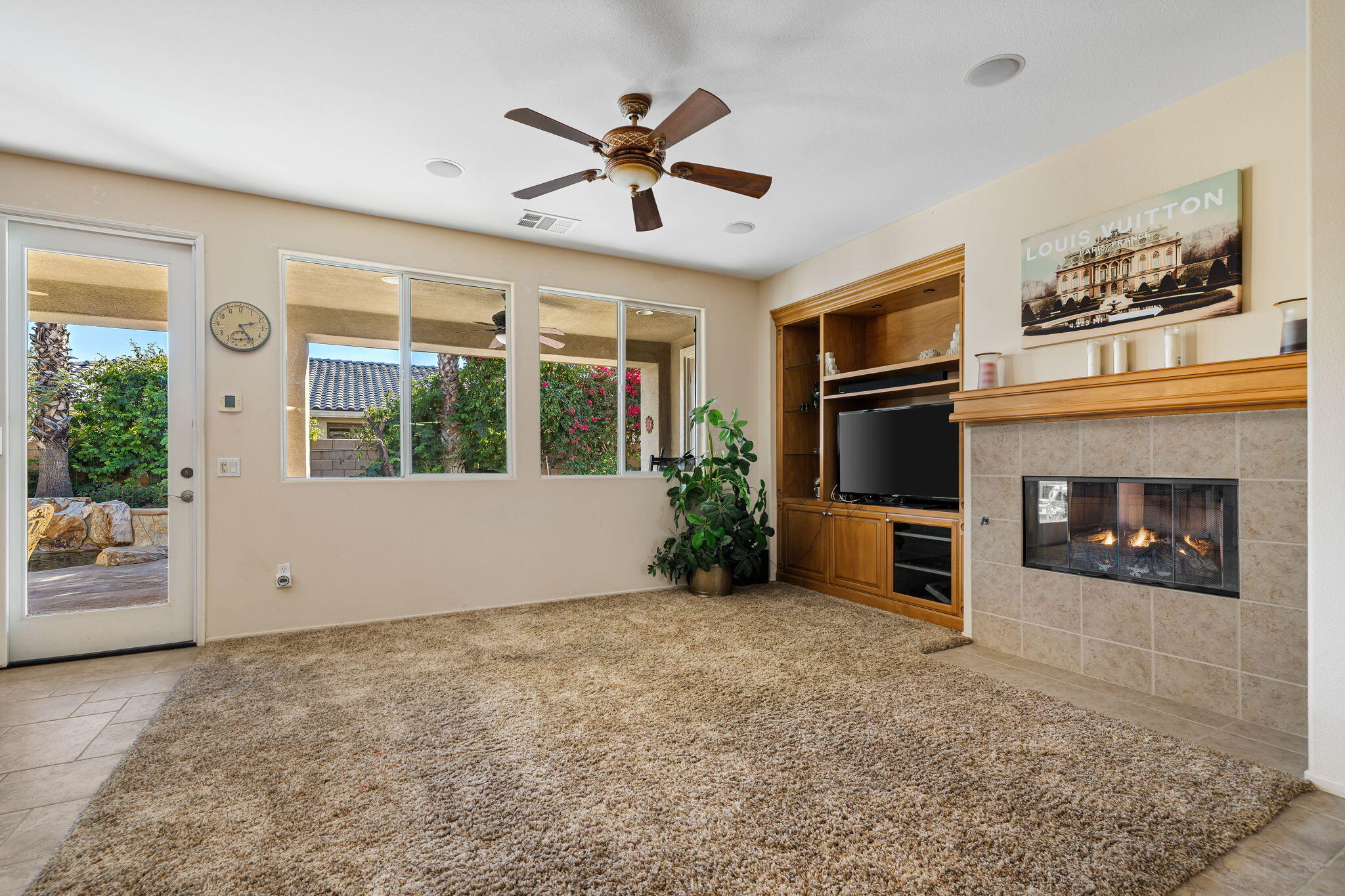83399 Wagon Road Indio, CA 92203 - Photo 26 of 48 a view of empty room with a fireplace and window